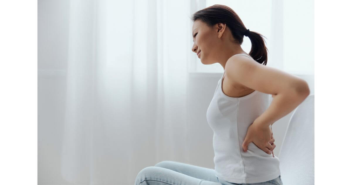 Woman experiencing back pain